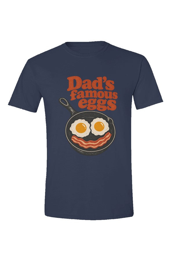 Navy t-shirt with Dad's famous eggs lettering over a skillet with eggs and bacon, flat front view on white.